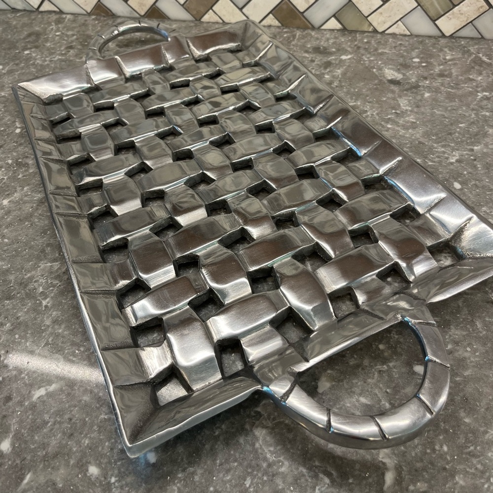 Aluminum Metal tray. Open weave appearance.